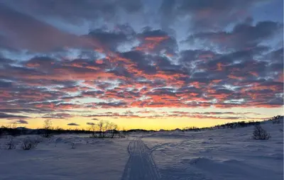 a snowy field with a sunset in the sky at Nice Apartment In Rauland With Wifi in Rauland