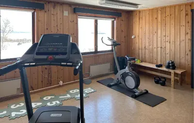 a room with a gym with a treadmill and a bench at Nice Apartment In Rauland With Wifi in Rauland