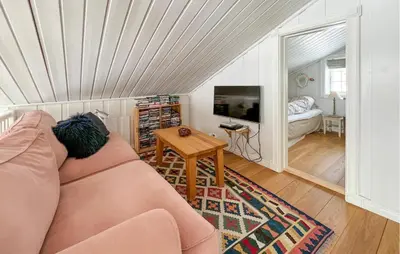 a living room with a couch and a table at Lovely Home In Aurdal With Sauna in Aurdal