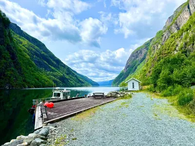 a boat on a dock in a mountain lake at Hylen in Kvilldal