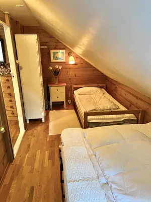 a bedroom with two beds in a attic at Hylen in Kvilldal