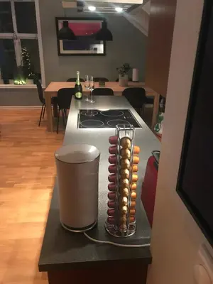 a kitchen counter with a stove and a stove top at Penthouse Ålesund city center in Ålesund