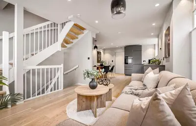 a living room with a couch and a table at Townhouse - 700 meters from Bryggen in Bergen