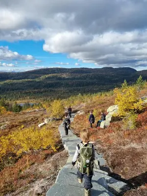 a group of people walking down a trail at Bright Cabin In Eggedals Beautiful Mountains in Eggedal