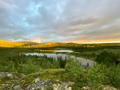 a view of a river with a rainbow in the distance at Upgraded Family Cabin At Sangefjell in Ål