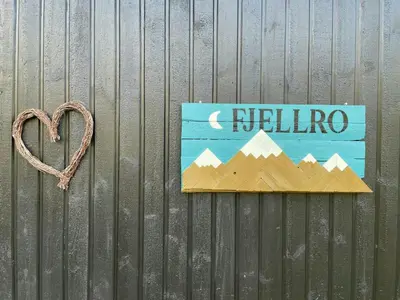 a sign on a fence with a heart next to it at Mountain Gem With Ski Inout In Rauland in Rauland
