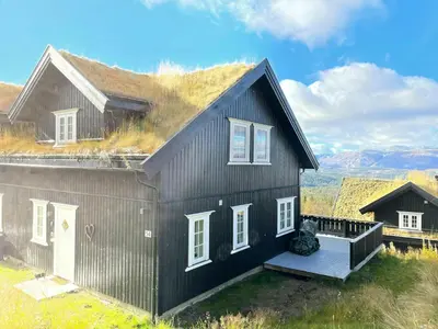 a black house with a grass roof at Mountain Gem With Ski Inout In Rauland in Rauland