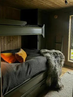 a bedroom with a bunk bed with a furry animal on it at Modern Cabin With Panoramic Views At Nesfjellet in Nesbyen