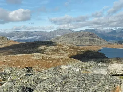 a view of a mountain with rocks and a lake at Traditional Mountain Cabin Near Hallingskarvet in Torpo