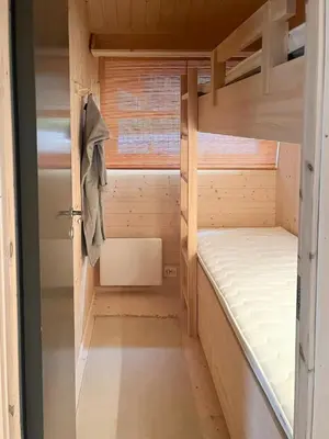 a small room with two bunk beds and a window at Architectural Gem With Views Of Hallingskarvet in Ål