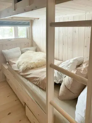 a bedroom with two bunk beds and a window at Cabin With A View And Close To Jotunheimen in Heggenes