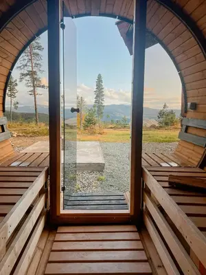 a view from the inside of a cabin with a large window at Log Cabin With Views Over Turufjell in Flå