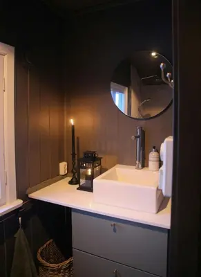 a bathroom with a white sink and a mirror at Charming Cabin In Vikerfjell in Hønefoss