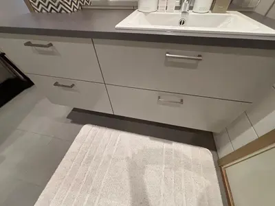 a bathroom with a sink and a white rug at Apartment in Myrkdalen Voss in Vossevangen
