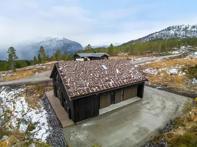 a small house with a roof on a mountain at Hydla Mountain Lodge in Stryn