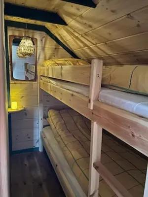 two bunk beds in a room with a ceiling at Støl ved Sognefjorden in Berge