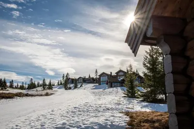 a winter view of a house in the snow at Nordic Gateway Logde in Hafjell