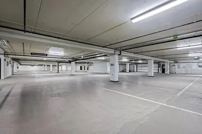 an empty parking lot in an empty parking garage at Modern and practical ski in & out apartment in Kyrkjebøen