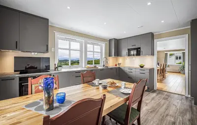 a kitchen and dining room with a table and chairs at Nice Home In Lundegrend With Wifi in Grimsland