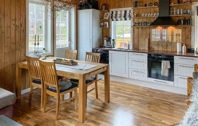 a kitchen with a wooden table and chairs at Beautiful Home In Bjorli With Wifi in Bjorli