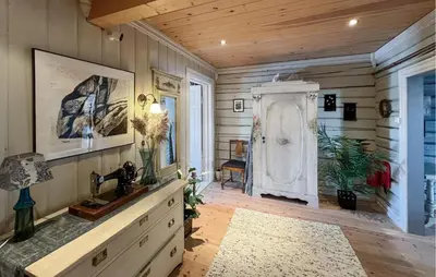 a room with a sink and a wooden wall at Nice Home In Sjusjøen With Wifi in Sjusjøen