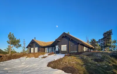 a log house on a hill with snow in front at Stunning Home In Flesberg With Sauna in Flesberg