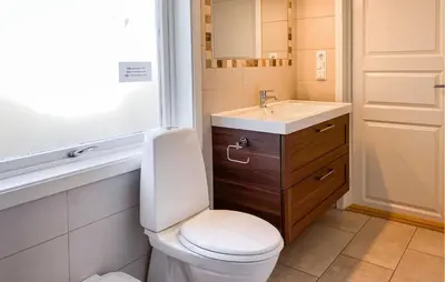 a bathroom with a toilet and a sink at Gorgeous Home In Kverva With Wifi in Kverva