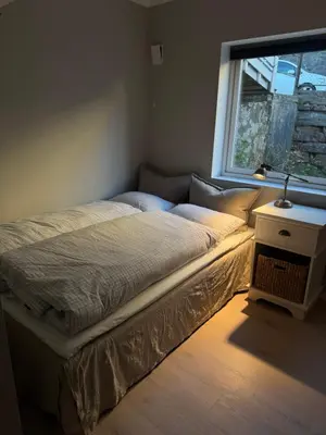 a bed sitting in a bedroom with a window at Apartment in Bergen in Bergen