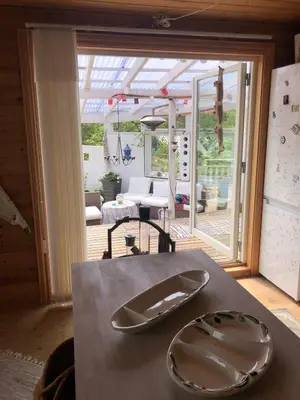 a table with two plates on top of it at Seaside Cabin with panoramic view in Bømlo