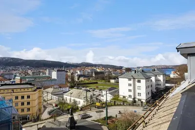 a view of a city from a building at Rom i loftsleilighet med utsikt in Bergen