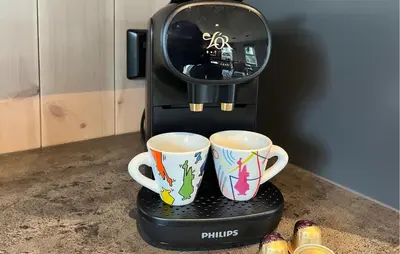 two coffee cups sitting on top of a coffee maker at Stunning Home In Sjusjøen With Sauna in Sjusjøen