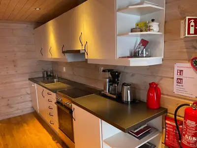 a kitchen with a sink and a counter top at Syndinstøga in Ryfoss