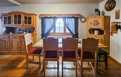 a kitchen with a table and chairs and a window at 4 Bedroom Amazing Home In Rødberg in Rødberg