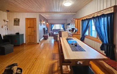 a living room with a wooden table in a room at 4 Bedroom Amazing Home In Rødberg in Rødberg