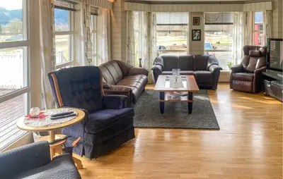 a living room with couches and a coffee table at 4 Bedroom Nice Home In Flornes in Flornes