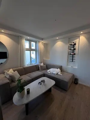 a living room with a couch and a table at Sental apartment in Sandviken in Bergen
