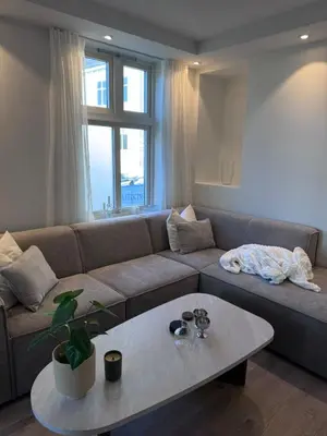 a living room with a couch and a table at Sental apartment in Sandviken in Bergen