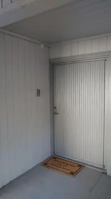 a garage with a door and a rug in it at Studio apartment 48m2 in Hølera