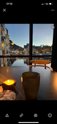 a table with two bowls on a table with a view at Nouveau Nook in Ålesund