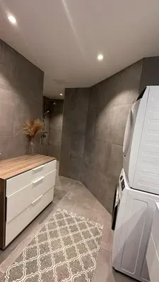 a kitchen with a white refrigerator and a rug at One bedroom apartment close to Asker centrum in Lii