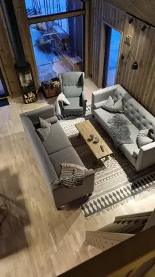 a living room with two couches and a table at Cabin Lillehammer, Nordseter, Sjusjøen in Lillehammer
