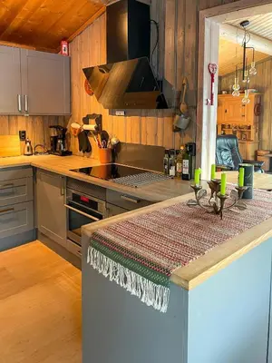 a kitchen with a stove and a counter top at Family Cabin With Views In Valdres in Reinli