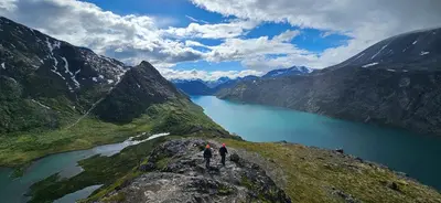 two people standing on top of a mountain overlooking a lake at Appartment at Stølstunet in Beitostølen in Beitostøl