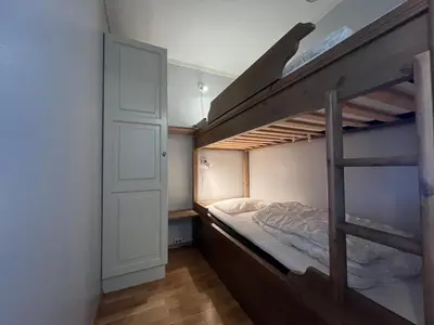 a bedroom with a bunk bed with a ladder at Appartment at Stølstunet in Beitostølen in Beitostøl