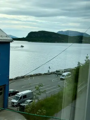 a parking lot next to a large body of water at Apartment by the center of Ålesund in Ålesund