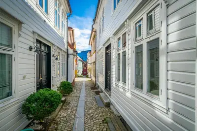 an alley between two buildings in a city at Bergen style Apt I Cozy street I Easy check in in Bergen
