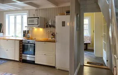 a kitchen with a refrigerator and a microwave at Stunning Home In Runde With Wifi in Runde