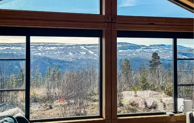 a room with a window looking out at the mountains at Stunning Home In Engerdal With Wifi in Nymoen