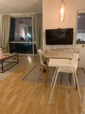 a living room with a table and a couch at 2 bedroom, lake view, light rail, Bergen in Bergen