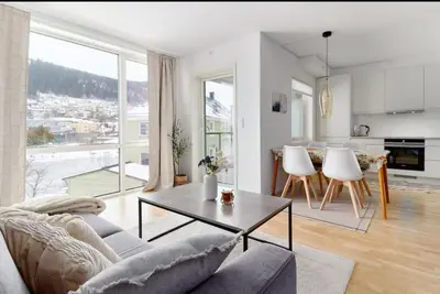 a living room with a couch and a table at 2 bedroom, lake view, light rail, Bergen in Bergen